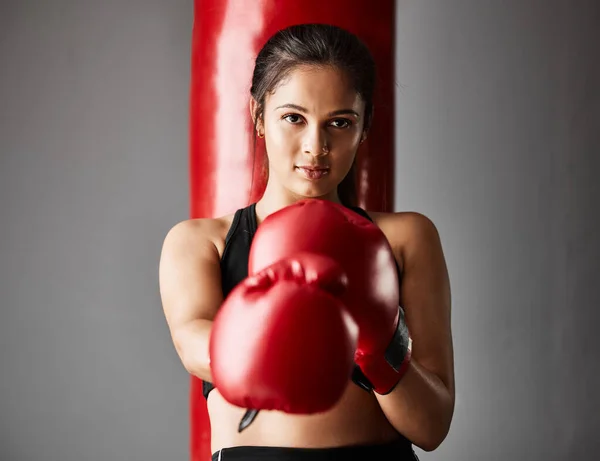 Strike first. Cropped portrait of an attractive young female boxer training in the gym. — Stock Photo, Image