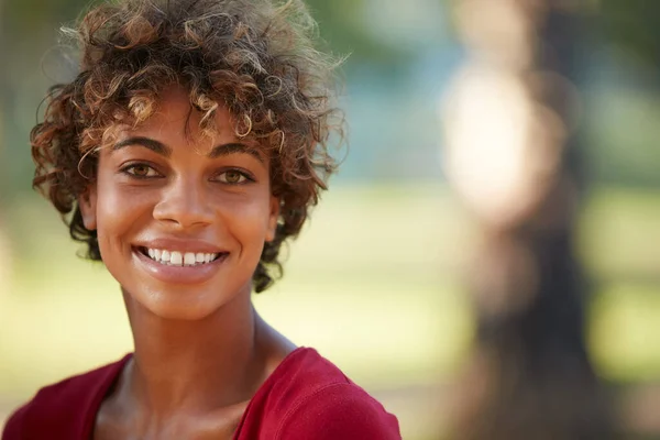 Smile, you dont know who youre inspiring. Portrait of a beautiful young woman spending the day outdoors on a sunny day. — Stock Photo, Image