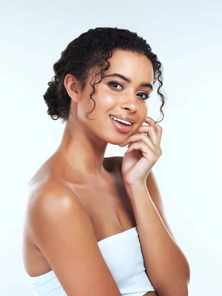 Beauty is a light in the heart. Portrait of an attractive young woman posing against a white background. — Stock Photo, Image