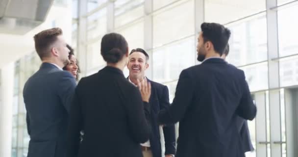 Another successful day at the office. 4k video footage of a group of businesspeople high fiving in their workplace. — Video Stock