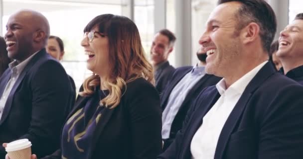 The crowd goes wild. 4k video footage of a group of businesspeople laughing during a conference. — Video Stock