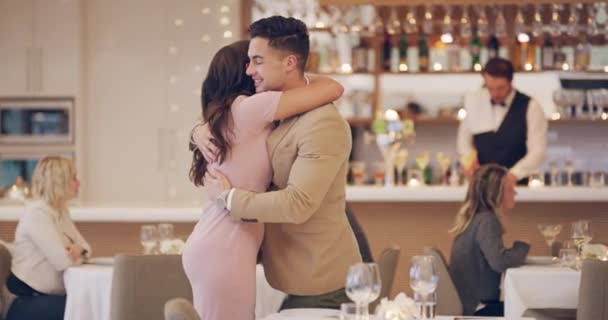 Ill do everything I can to impress her tonight. 4k video footage of a man getting up to greet his date at a restaurant. — Wideo stockowe