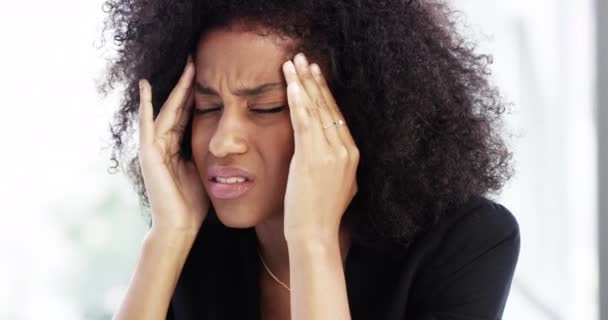 Too much stress is never good. 4k video footage of a young businesswoman looking stressed while sitting in her corporate office. — Stock videók