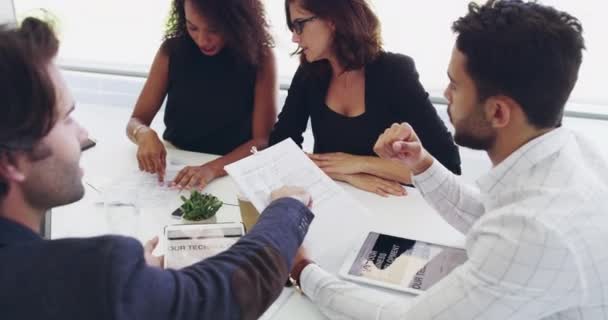 Not just on target, weve exceeded it. 4k video footage of a group of young businesspeople having a meeting. — Stockvideo