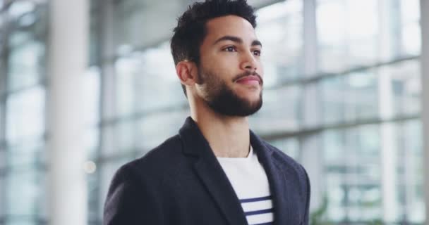 All good to go. 4k video footage of a young businessman showing thumbs up while walking through a modern office. — Stok video