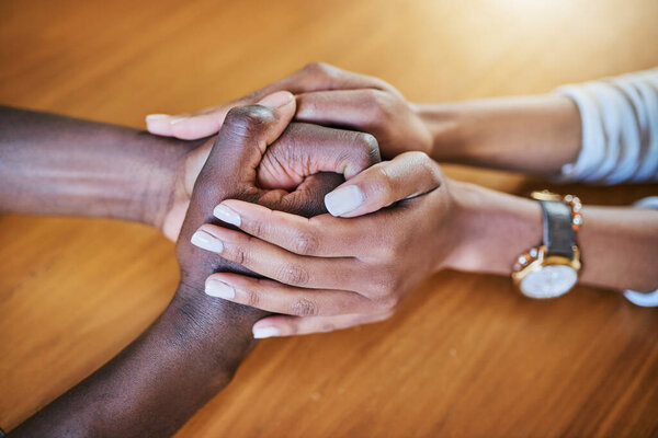 Ill always be here. Closeup shot of two unidentifiable people holding hands in comfort.