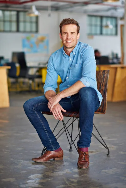 Designing my perfect career. Portrait of a handsome young designer sitting on a chair in an office. — Stock Photo, Image