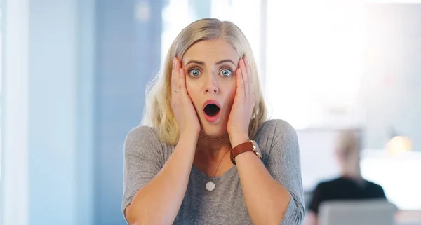 I messed up big time. Portrait of a confident young businesswoman looking surprised and holding her hands close to her face inside of the office. — Stock Photo, Image