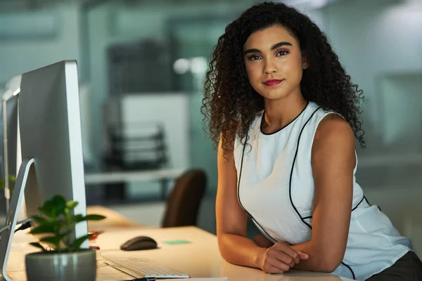 Ive got my career in focus. Portrait of a confident young businesswoman working at her desk at night. — Stock Photo, Image