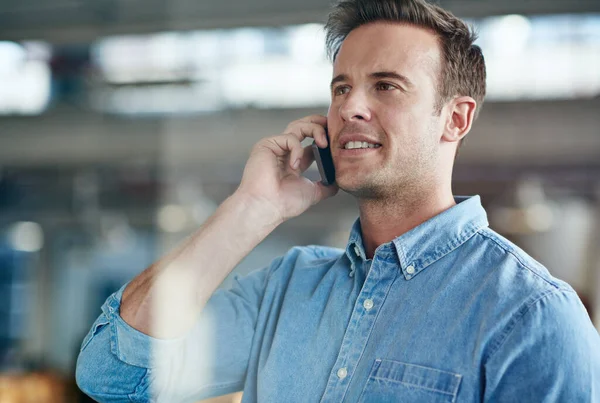 Hes a model employee. Cropped shot of a casually-dressed businessman standing in his office. — Foto de Stock