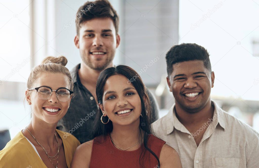 We always keep optimism on our side. Portrait of a group of businesspeople standing together in an office.