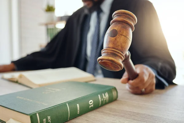 We need order in here. Shot of an unrecognizable lawyer using a gavel at work. — Stock Photo, Image