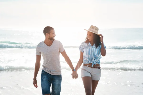 Im so happy to have you in my life. Shot of a young couple walking along the beach. — Stock Photo, Image