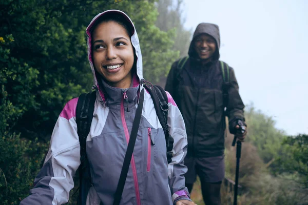 Leading the way. Cropped shot of an affectionate young couple enjoying their early morning hike in the mountains. — Stock Photo, Image