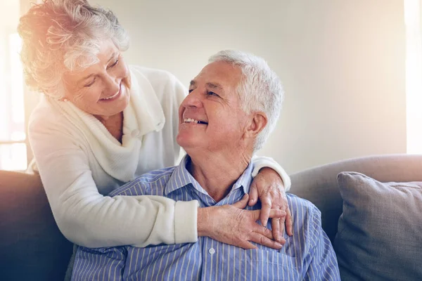 I knew we had magic from the moment we met. Cropped shot of a senior couple relaxing at home. — Stock Photo, Image