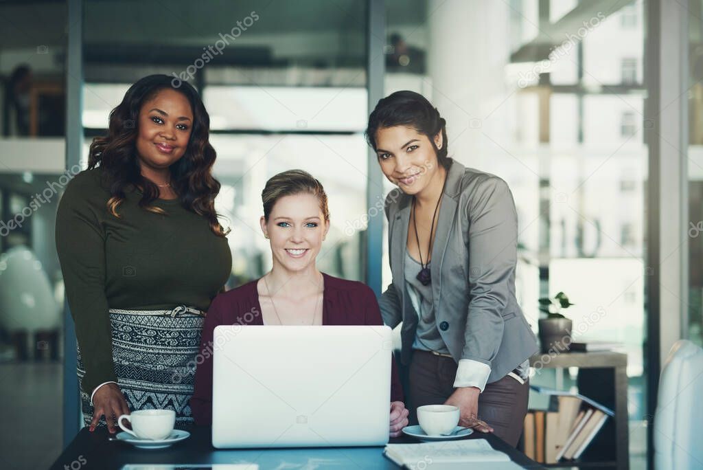 Well get the job done. Cropped portrait of three businesswoman gathered around a laptop in the office.