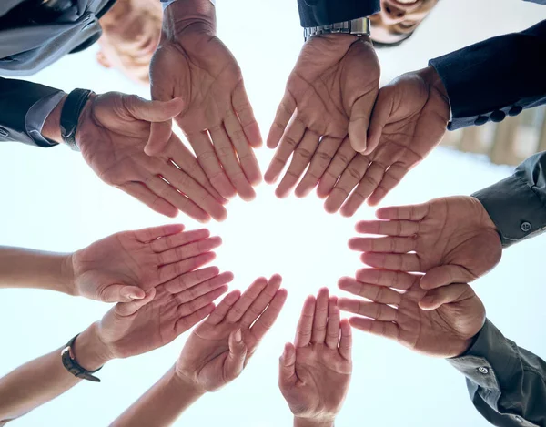 Lets put our hands together. Shot of a group of unrecognizable businesspeople putting their hands together in a circle. — Stock Photo, Image