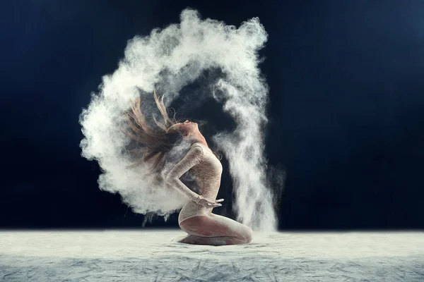 Sensationally sensual. Studio shot of a young woman leaving a trail of powder in the air by whipping her hair. — Stock Photo, Image