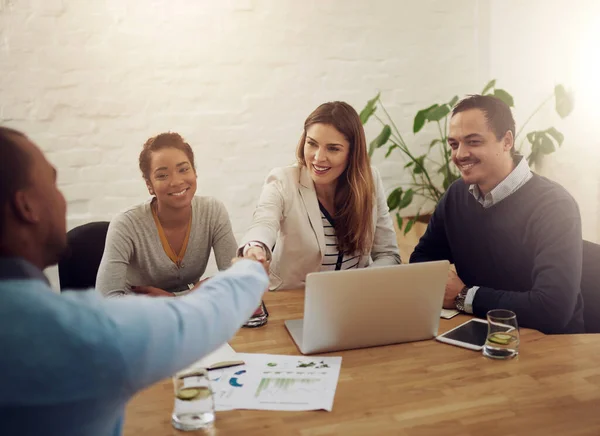 Shot of a group of colleagues in a meeting at the office.