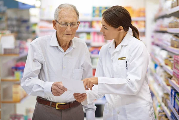 Shot Young Pharmacist Helping Elderly Customer His Prescription — Stock Photo, Image