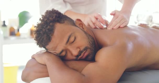 Young Relaxed Man Enjoying Relaxing Therapeutic Back Massage Treatment Vacuum — Stock Video