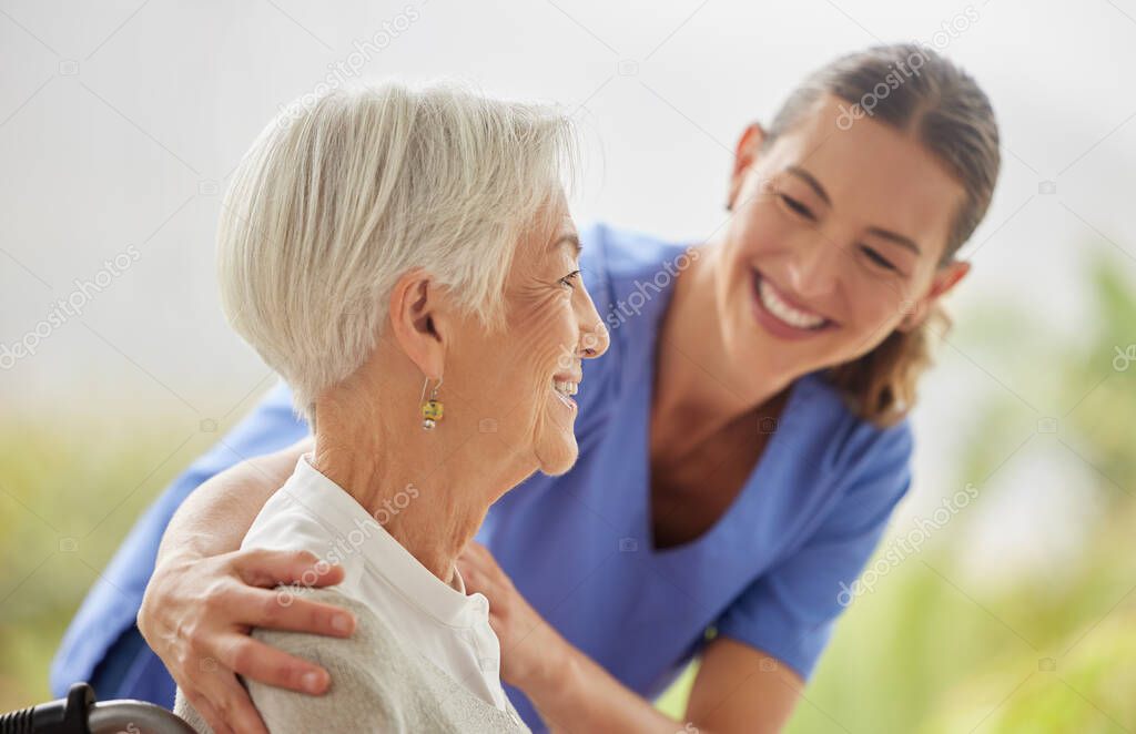 Friendly nurse doctor offering patient support during recovery. A loving caregiver taking care of her patient and showing kindness while doing a checkup in assisted living home.