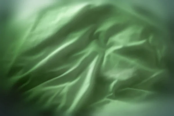 Green Satin Fabric Textures Velvet Smooth Material Elegant Folds Closeup — Stockfoto