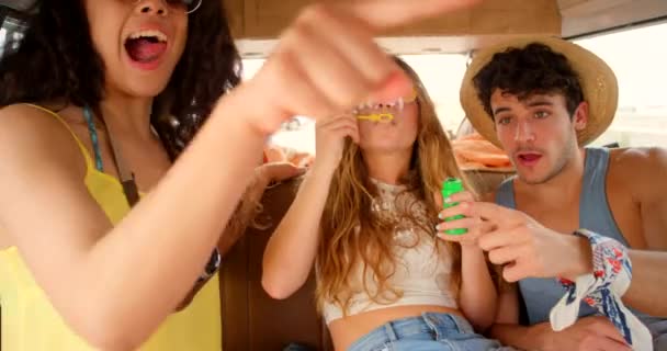 Group Excited Friends Blowing Popping Bubbles Camper Van — Stockvideo