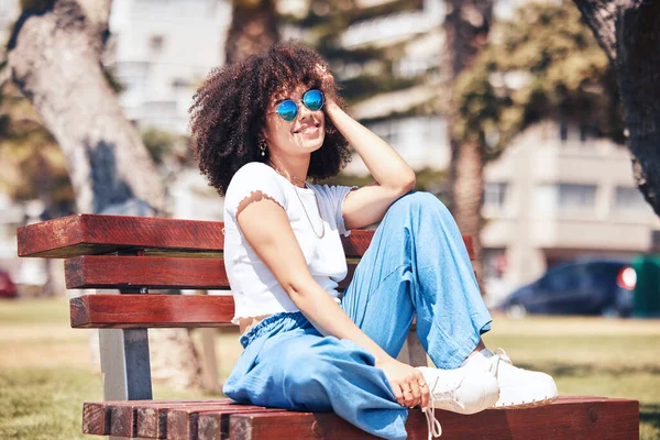 Cheerful Hispanic Woman Wearing Sunglasses Sitting Park Bench Carefree Young — Foto Stock