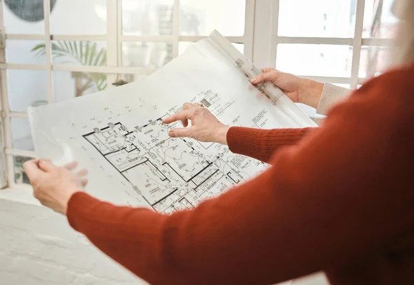 stock image Hands of businesspeople holding a blueprint. Closeup of architect holding a building plan. Two colleagues collaborate on building project. Engineers collaborate on building blueprint