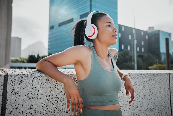 Young Mixed Race Hispanic Female Athlete Wearing Headphones Listening Music — ストック写真