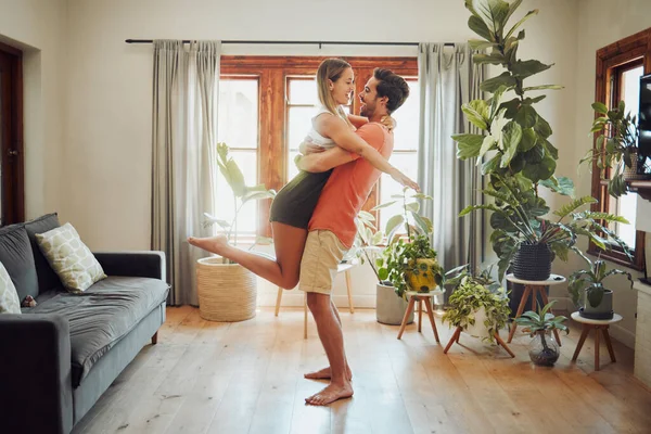 Happy Young Boyfriend Holding Girlfriend Arms Lifts Her While Look — Foto Stock