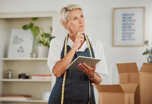 Packing, shipping and logistics in a modern workplace. Boxes being prepared for sending out.