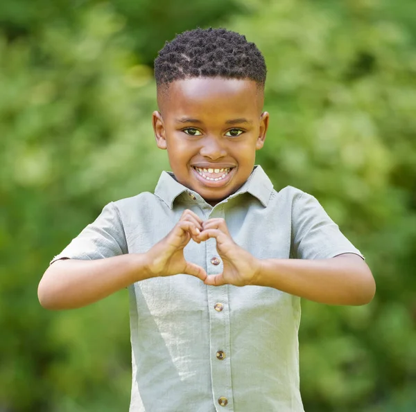 Shot Adorable Little Boy Showing Heart Symbol While Standing — Stockfoto