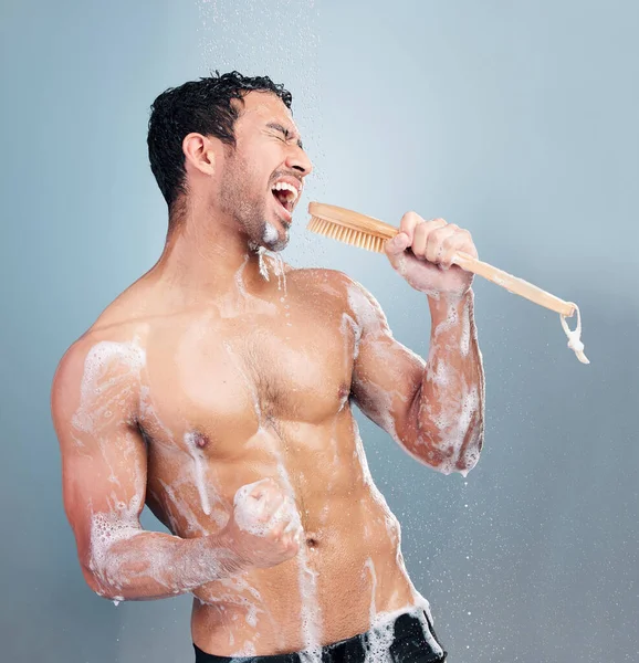 One Young Muscular Mixed Race Man Singing Shower Blue Studio — Stock fotografie