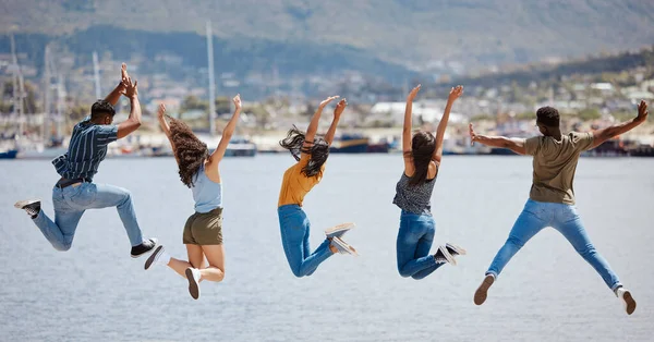 Rearview Shot Group Friends Jumping Together Pier — Foto de Stock