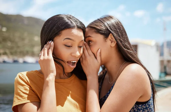 Shot Young Woman Whispering Her Friends Ear While Hanging Out —  Fotos de Stock