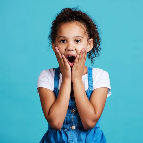 Shot Little Girl Looking Surprised While Posing Blue Background — Foto de Stock