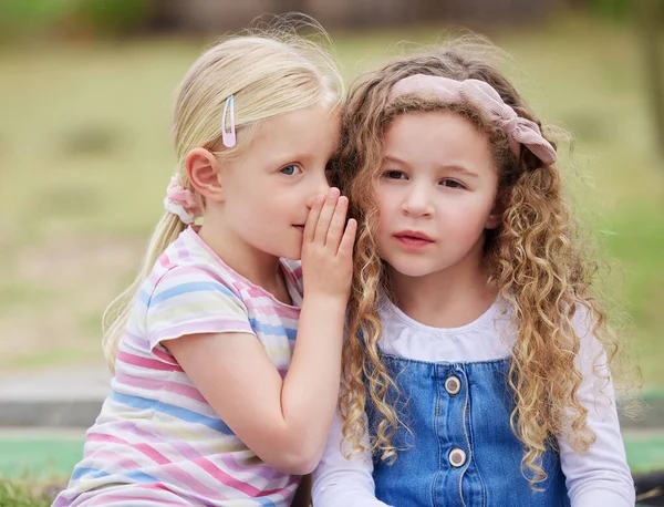 Shot Little Girl Whispering Her Friends Ear — Stockfoto