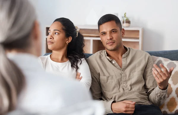 Shot Young Couple Sitting Together Looking Annoyed Consultation Psychologist — Stockfoto
