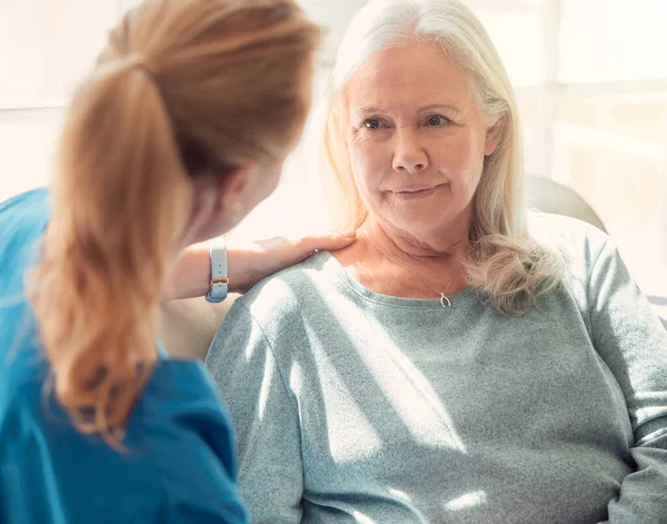 Shot Senior Woman Being Supported Her Nurse Home — Stockfoto