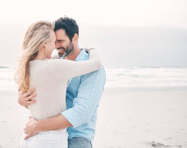 Shot of a mature couple spending a day at the beach.