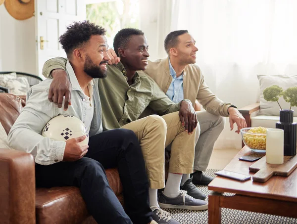 Shot Three Male Friends Watching Something Together While Sitting Couch — Foto Stock