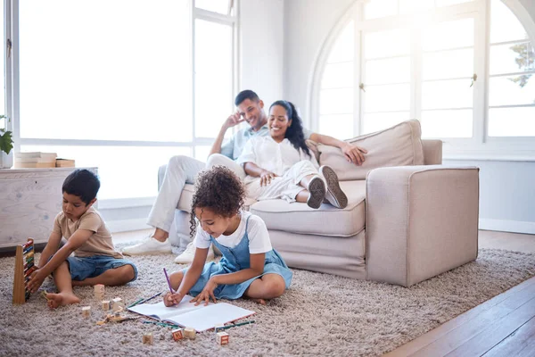 Shot Two Little Siblings Playing Toys Writing Book While Parents — Stock Photo, Image