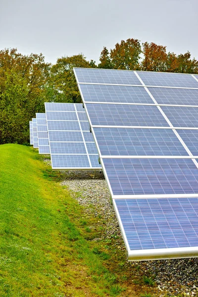 Solar power plant. A renewable energy source producing sustainable clean solar energy from the sun. Photovoltaic panels generating alternative energy from nature on an off the grid farm in Denmark.