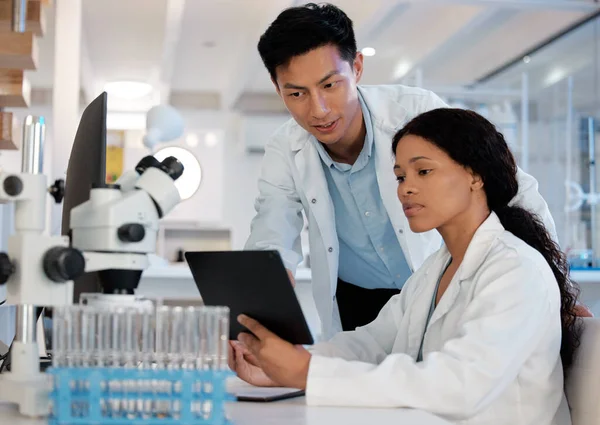 Shot Two Lab Techs Working Together While Using Digital Tablet — Foto Stock