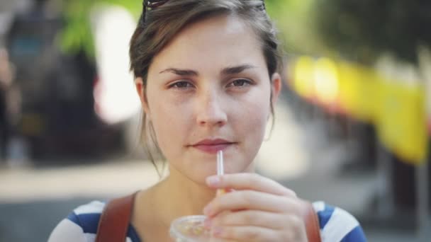 Video Footage Young Woman Enjoying Some Orange Juice While Out — Stockvideo