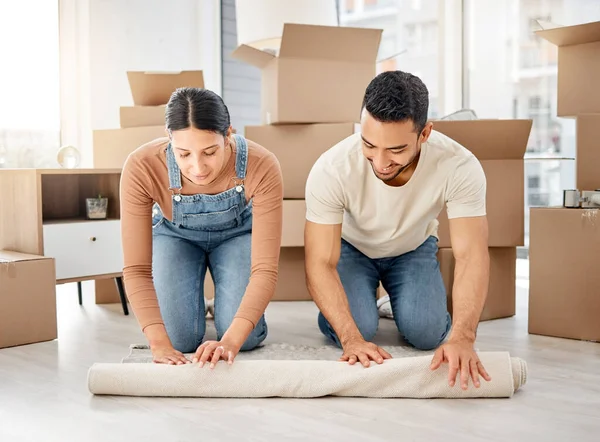Shot Young Couple Rolling Out Carpet Together New Home — 스톡 사진