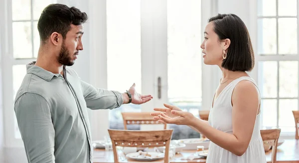 Shot of a young couple having an argument at home.