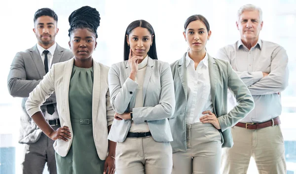 Cropped portrait of a diverse group of corporate businesspeople standing in their office.